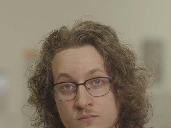 Close portrait of Albert Gajšak in glasses, filmed in the CircuitMess office for a European Commission feature.